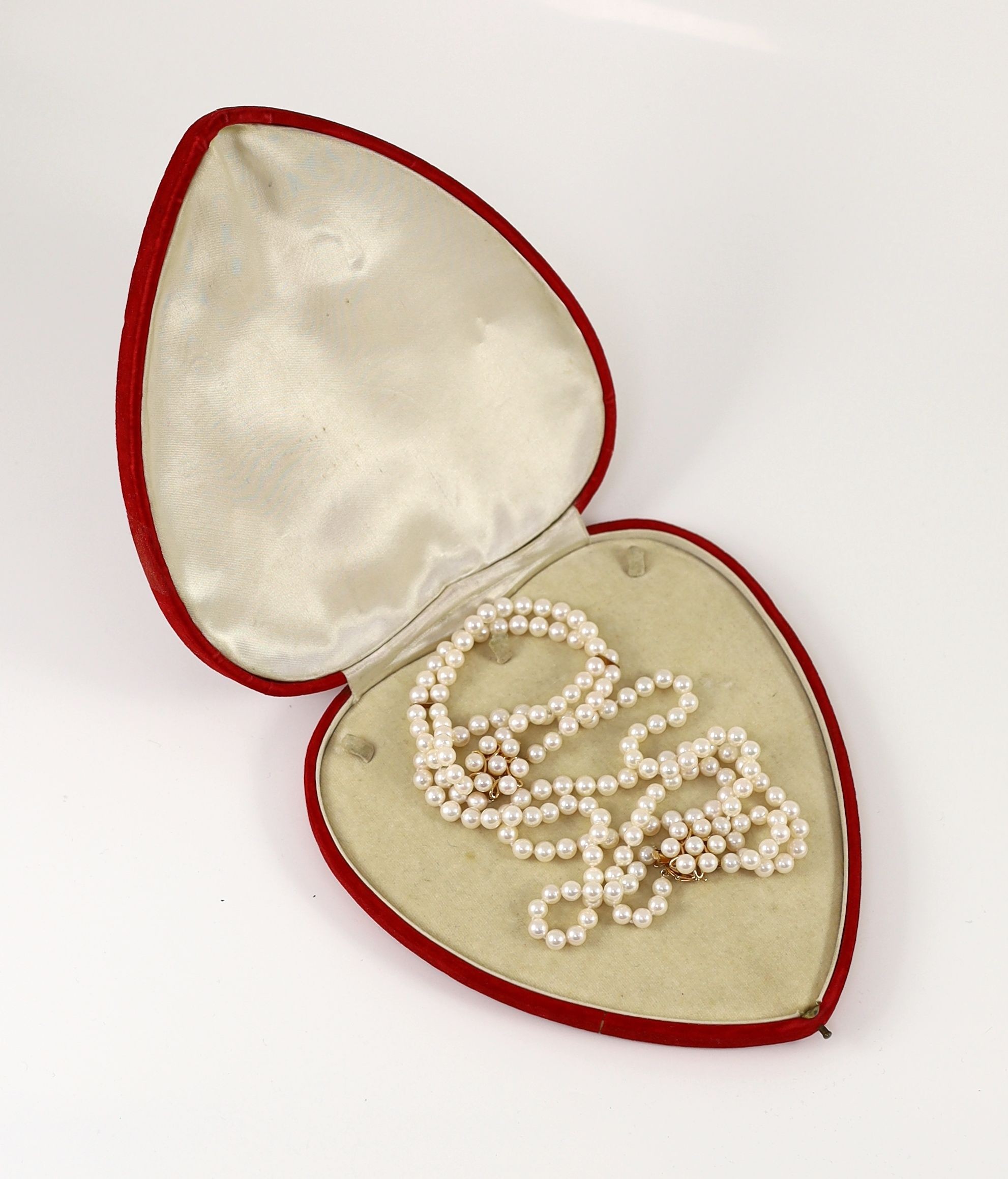 A modern continental double strand cultured pearl necklace with 14k gold and cultured pearl cluster set clasp and a matching bracelet